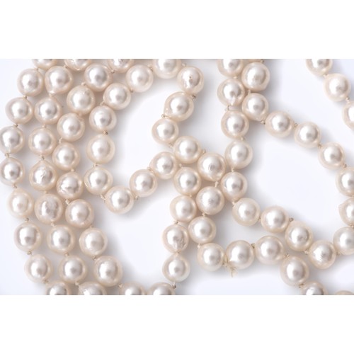 687 - A STRAND OF OPERA LENGTH PEARLS