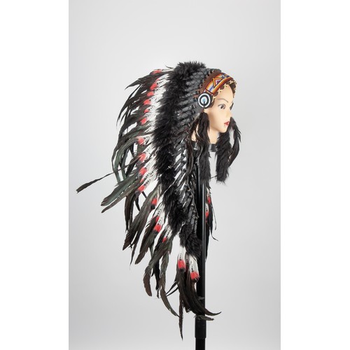 252 - AN INDIAN FEATHERED HEAD DRESS