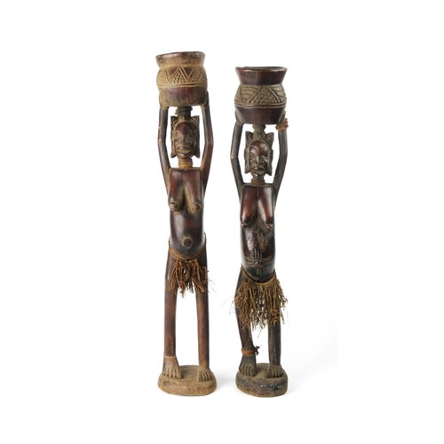 424 - A PAIR OF FEMALE WOODEN FIGURES