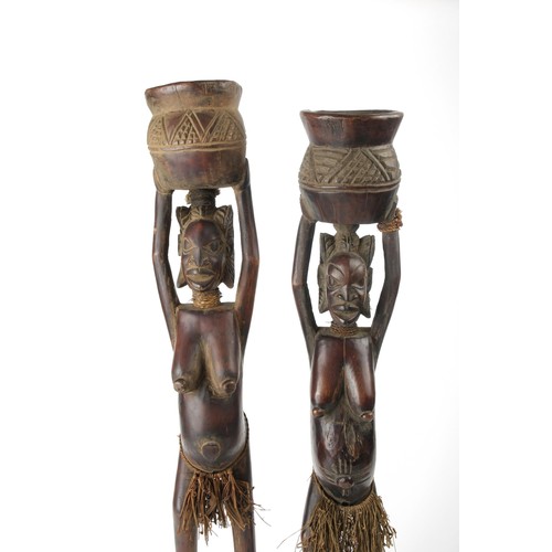 424 - A PAIR OF FEMALE WOODEN FIGURES