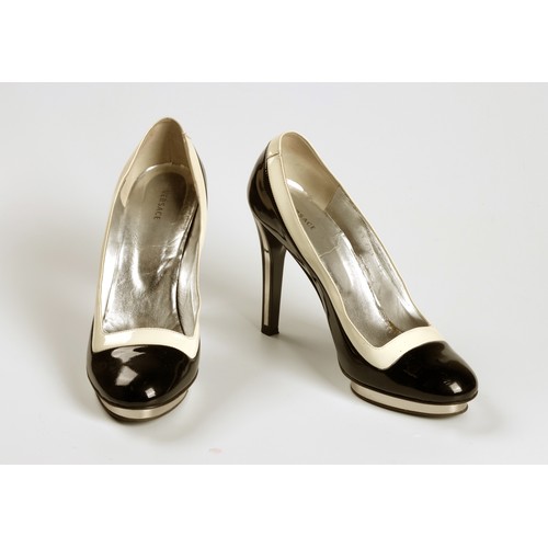 673 - A PAIR OF VERSACE BLACK PATENT LEATHER PLATFORM HEELS