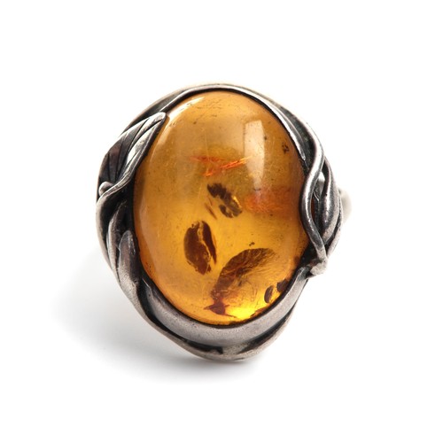 1230 - AN AMBER RING