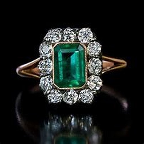 AN EMERALD AND DIAMOND COCKTAIL RING WEST JEWELLERS DUBLIN POSSIBLY VICTORIAN