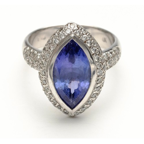 1021 - A TANZANITE AND DIAMOND DRESS RING