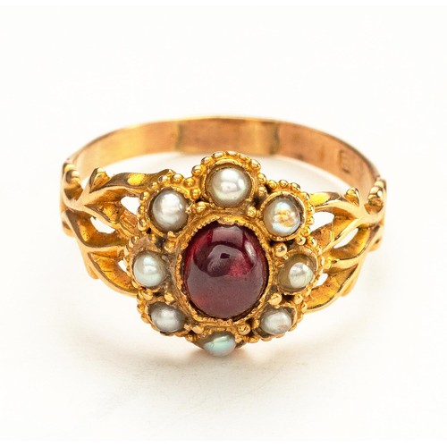 876 - A GARNET AND PEARL DRESS RING