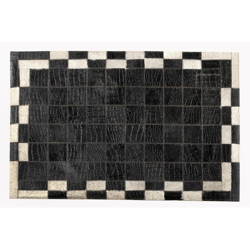 214 - AN INDO LEATHER RUG&nbsp;91 by 60cm