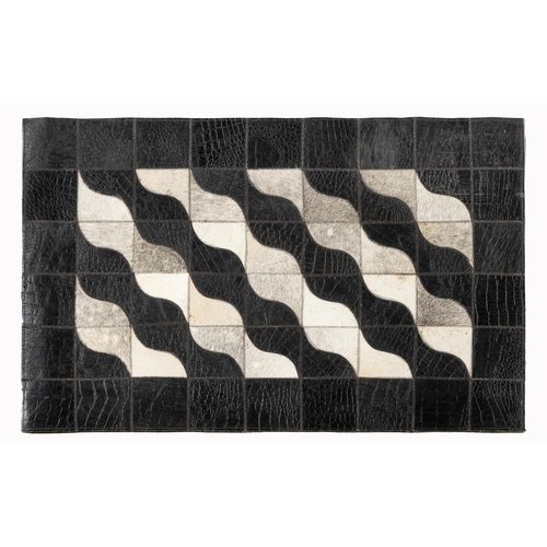 215 - AN INDO LEATHER RUG&nbsp;90 by 60cm