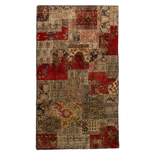 377 - A PATCHWORK RUG 250 by 152cm