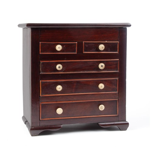 29 - A MAHOGANY MINIATURE CHEST-OF-DRAWERS
