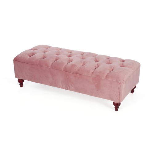 AN UPHOLSTERED BUTTONED OTTOMAN