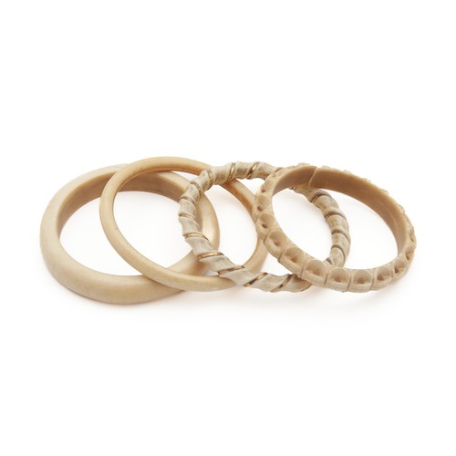 1264 - A COLLECTION OF BONE BANGLES