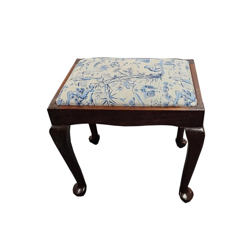 332 - AN UPHOLSTERED PIANO STOOL