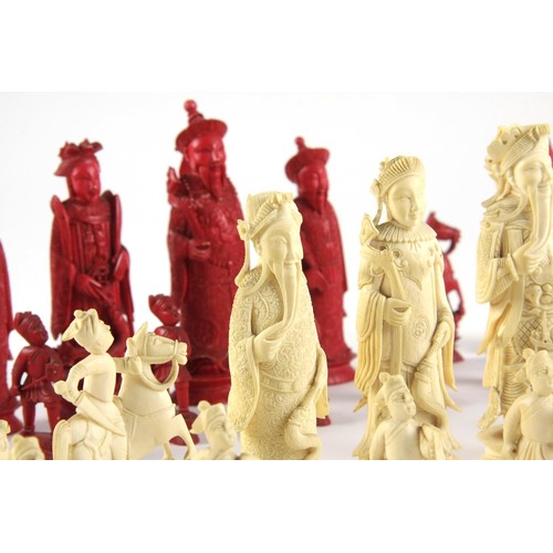 22 - A CARVED TUSK CHESS SET