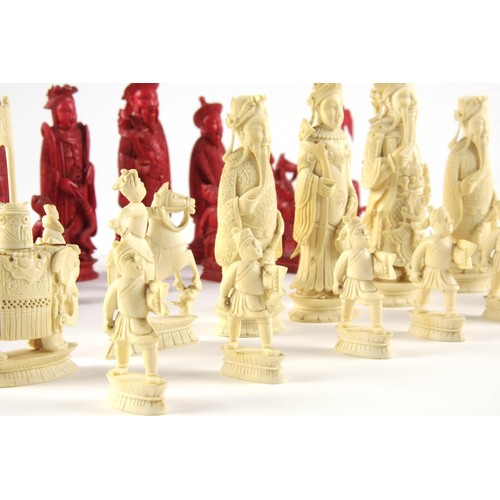 22 - A CARVED TUSK CHESS SET