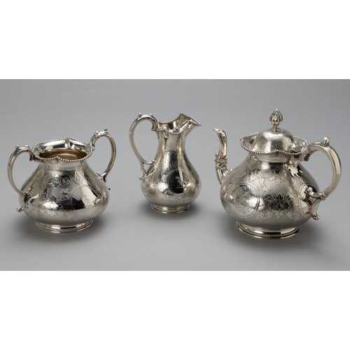 611 - A VICTORIAN SILVER THREE-PIECE TEA SERVICE, THOMAS BRADBURY AND SONS, SHEFFIELD, 1864