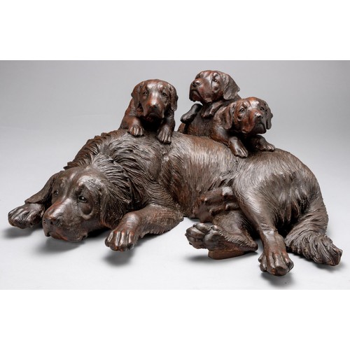 1210 - A BLACK FOREST CARVED DOG AND PUPS