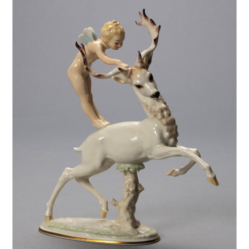 743 - A HUTSCHENREUTHER PORCELAIN 'CHERUB AND ELK' FIGURINE BY C. WERNER, EARLY 20TH CENTURY