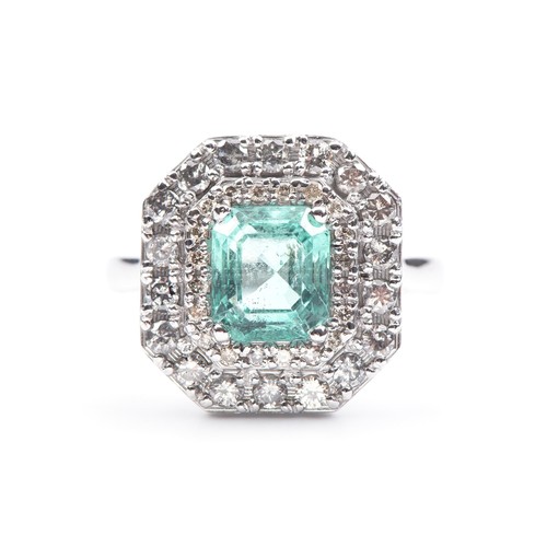 1019 - AN EMERALD AND DIAMOND RING