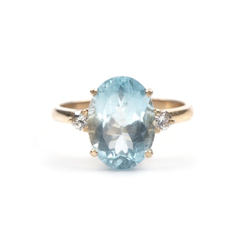 1038 - AN AQUAMARINE AND DIAMOND DRESS RING