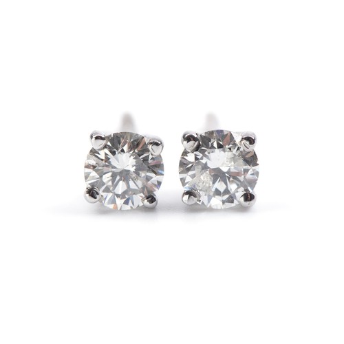 954 - A PAIR OF DIAMOND STUDS, 0.75 CARATS