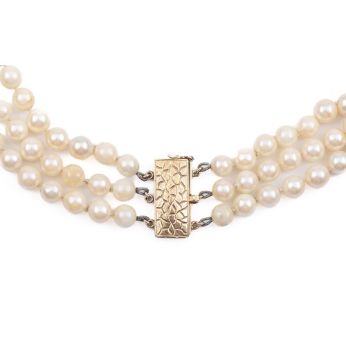 861 - A TRIPLE STRAND OF PEARLS, CIRCA 1960