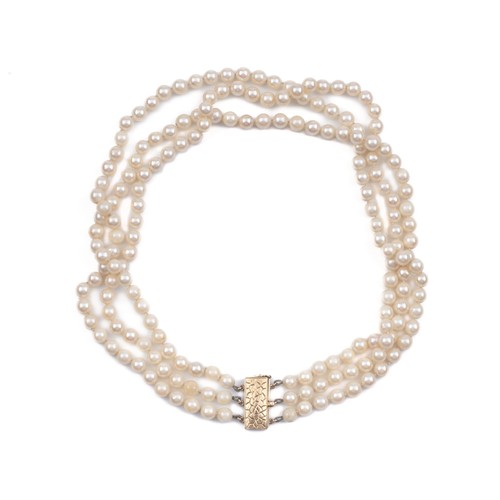 861 - A TRIPLE STRAND OF PEARLS, CIRCA 1960