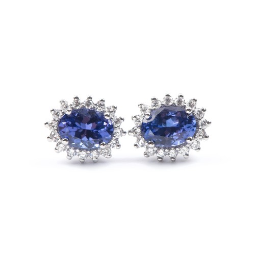 950 - A PAIR OF DIAMOND AND TANZANITE EARRINGS