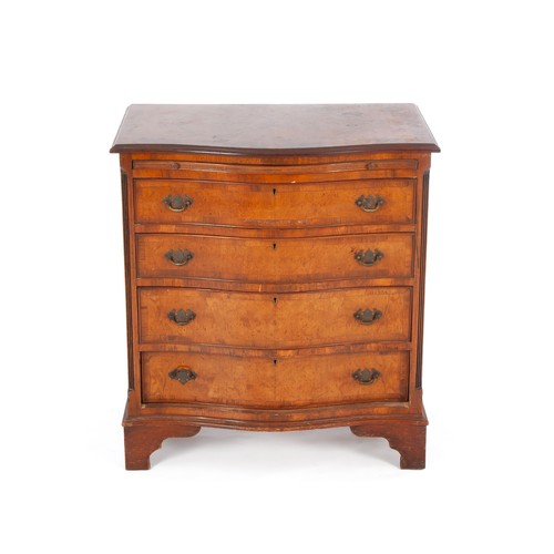 245 - A WALNUT CHEST-OF-DRAWERS