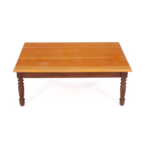 235 - A RECTANGULAR FRUITWOOD COFFEE TABLE