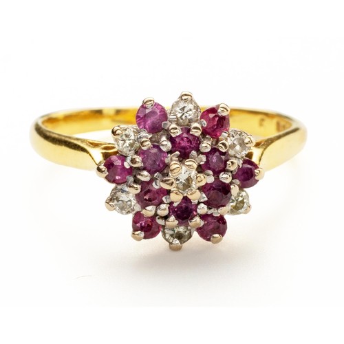 1034 - A RUBY AND DIAMOND CLUSTER RING