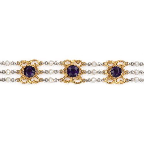 869 - AN AMETHYST AND PEARL BRACELET