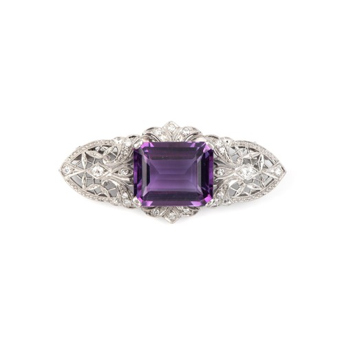 935 - AN AMETHYST AND DIAMOND BROOCH