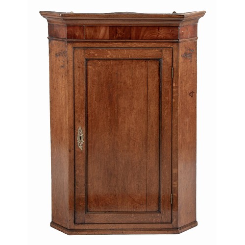 257 - A MAHOGANY AND ELM HANGING CORNER CUPBOARD, EARLY 19TH CENTURY