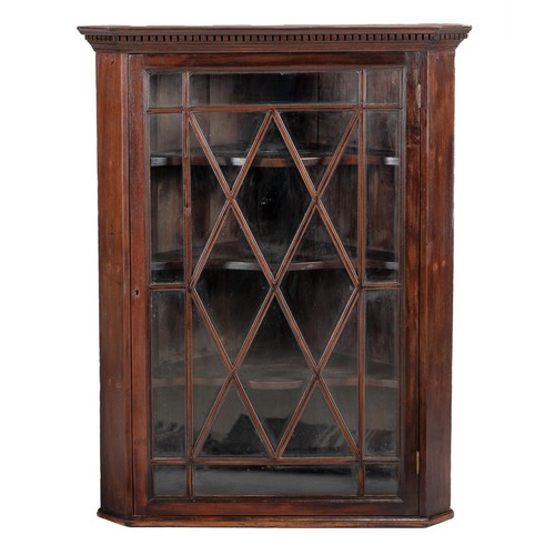 255 - A GEORGE III MAHOGANY HANGING CORNER CUPBOARD