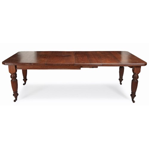 312 - A MAHOGANY EXTENDING DINING TABLE, FIRST QUARTER 20TH CENTURY