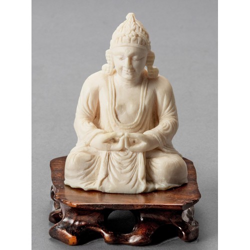 226 - AN INDIAN CARVED FIGURE OF BUDDHA