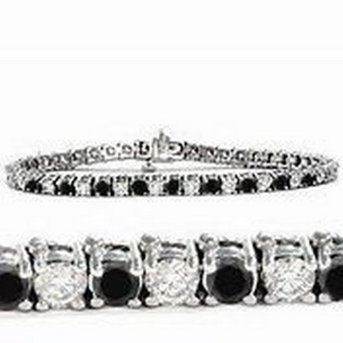 970 - A BLACK AND WHITE DIAMOND TENNIS BRACELET