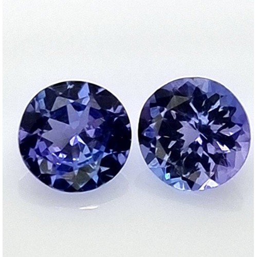 1102 - A PAIR OF CASED TANZANITES, 0.85 CARATS