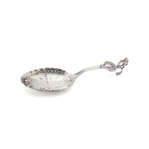 154 - A SILVER CADDY SPOON, MAKER AND DATE MARKS RUBBED