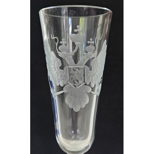 65 - A PART SUITE OF GLASSWARE ENGRAVED WITH A DOUBLE HEADED EAGLE