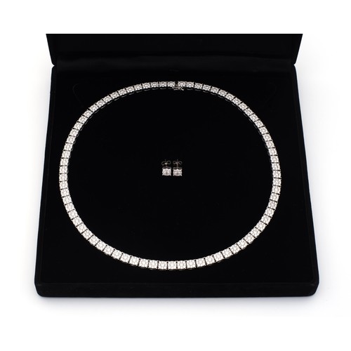 111 - A DIAMOND TENNIS NECKLACE, 21.02 CARATS WITH A PAIR OF MATCHING STUD EARRINGS, 0.60 CARATS