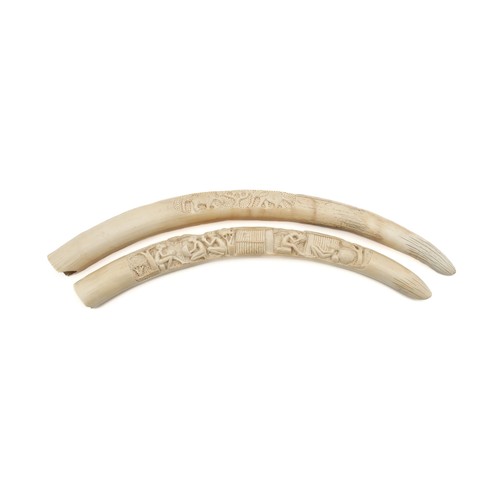 23 - A PAIR OF HANDCARVED BONE ORNAMENTS, CIRCA 1920