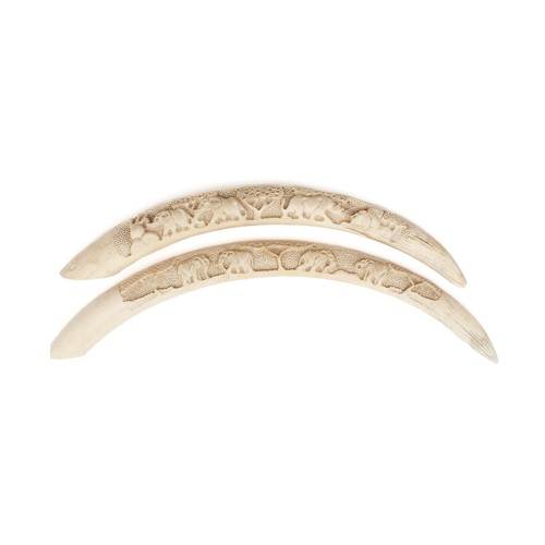 24 - A PAIR OF HANDCARVED BONE ORNAMENTS, CIRCA 1920