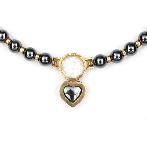 79 - A HEMATITE AND PEARL NECKLACE AND ENHANCER