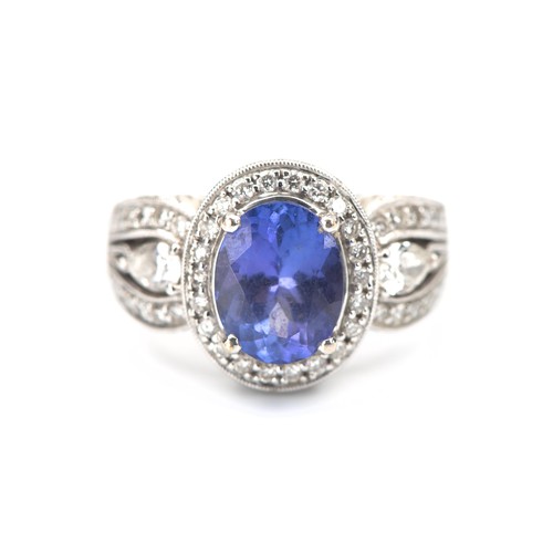 151 - A TANZANITE AND DIAMOND DRESS RING