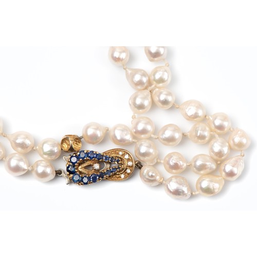 92 - A STRAND OF OPERA LENGTH PEARLS