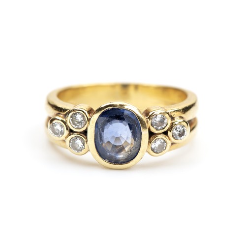 150 - A TANZANITE AND DIAMOND DRESS RING