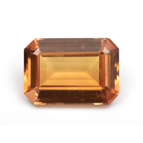 219 - AN UNSET TOPAZ, 9 CARATS