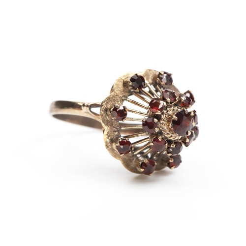 155 - A GARNET DRESS RING