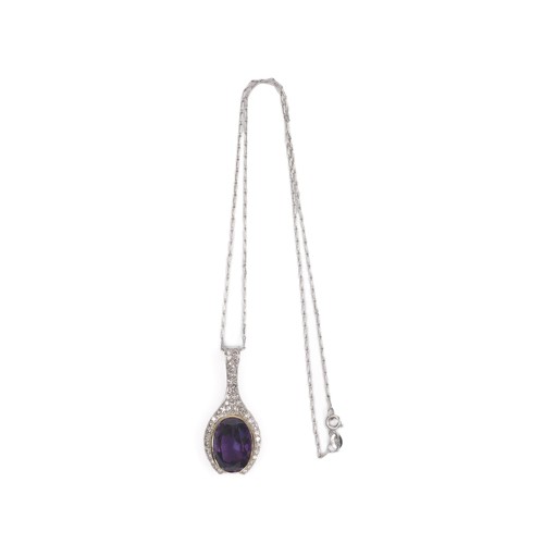 54 - AN AMETHYST AND DIAMOND PENDANT